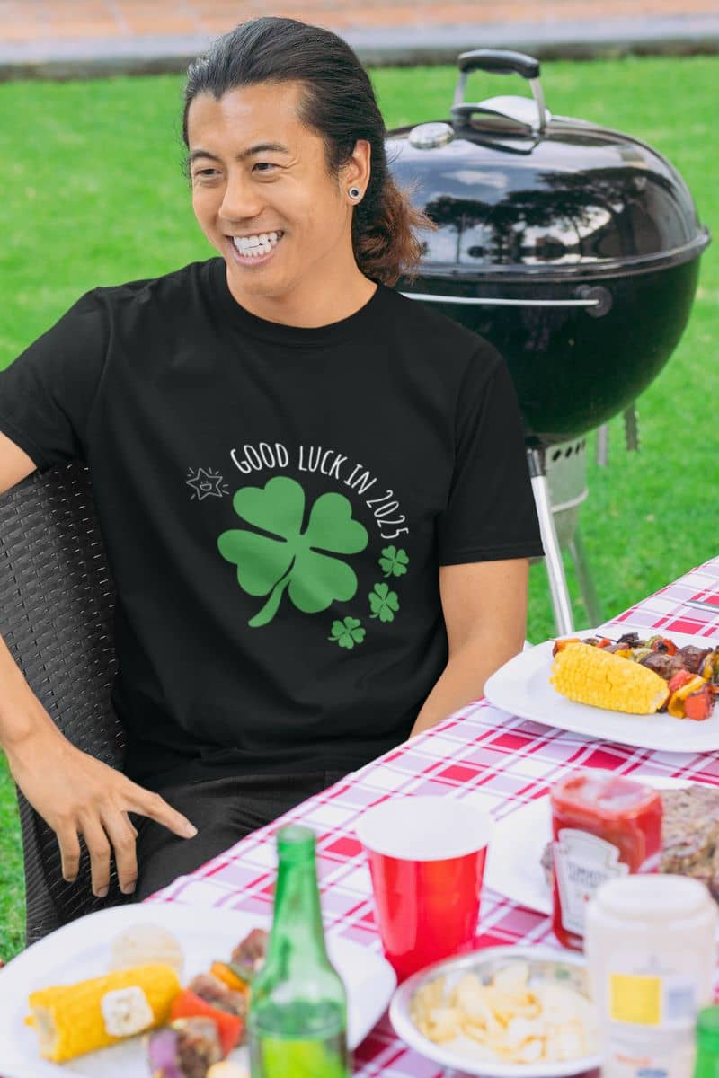 Good Luck in 2025 T-Shirt with a smiling guy at an outdoor party