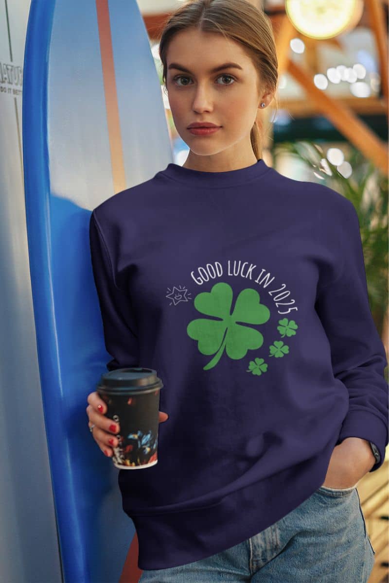 Good luck in 2025 sweatshirt with the girl holding a cup of coffee and leaning her shoulders against the skateboards