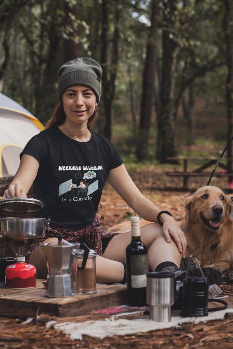 Graphic t-shirt for men with a girl sitting making coffee in front of her tent