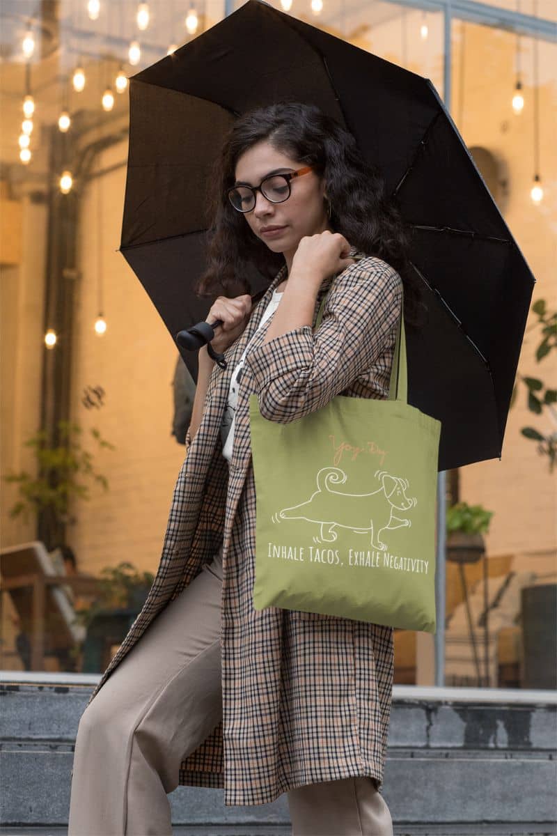 Inhale Tacos Exhale Negativity Tote Bag with a girl holding an umbrella