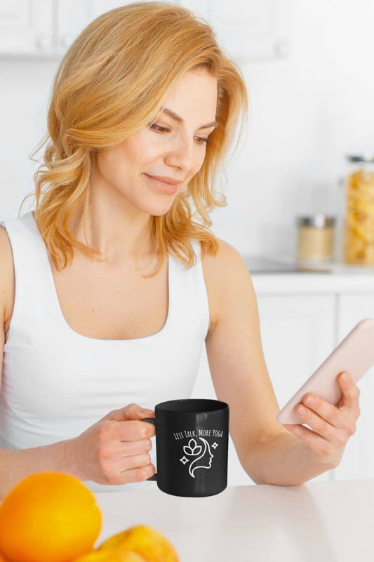 Less talk, more yoga mug with girl holding cup while looking at phone
