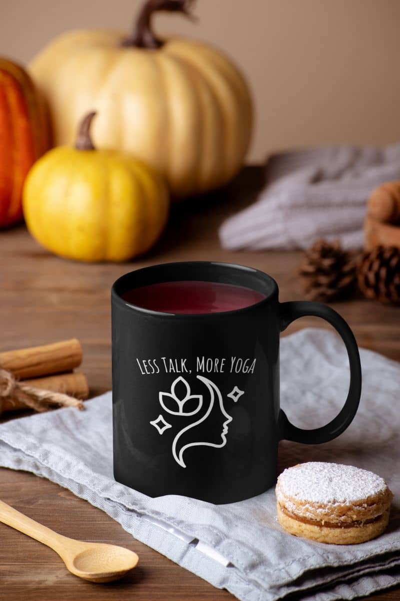 Less talk, more yoga mug with 1 cup of water, cookies and pumpkin