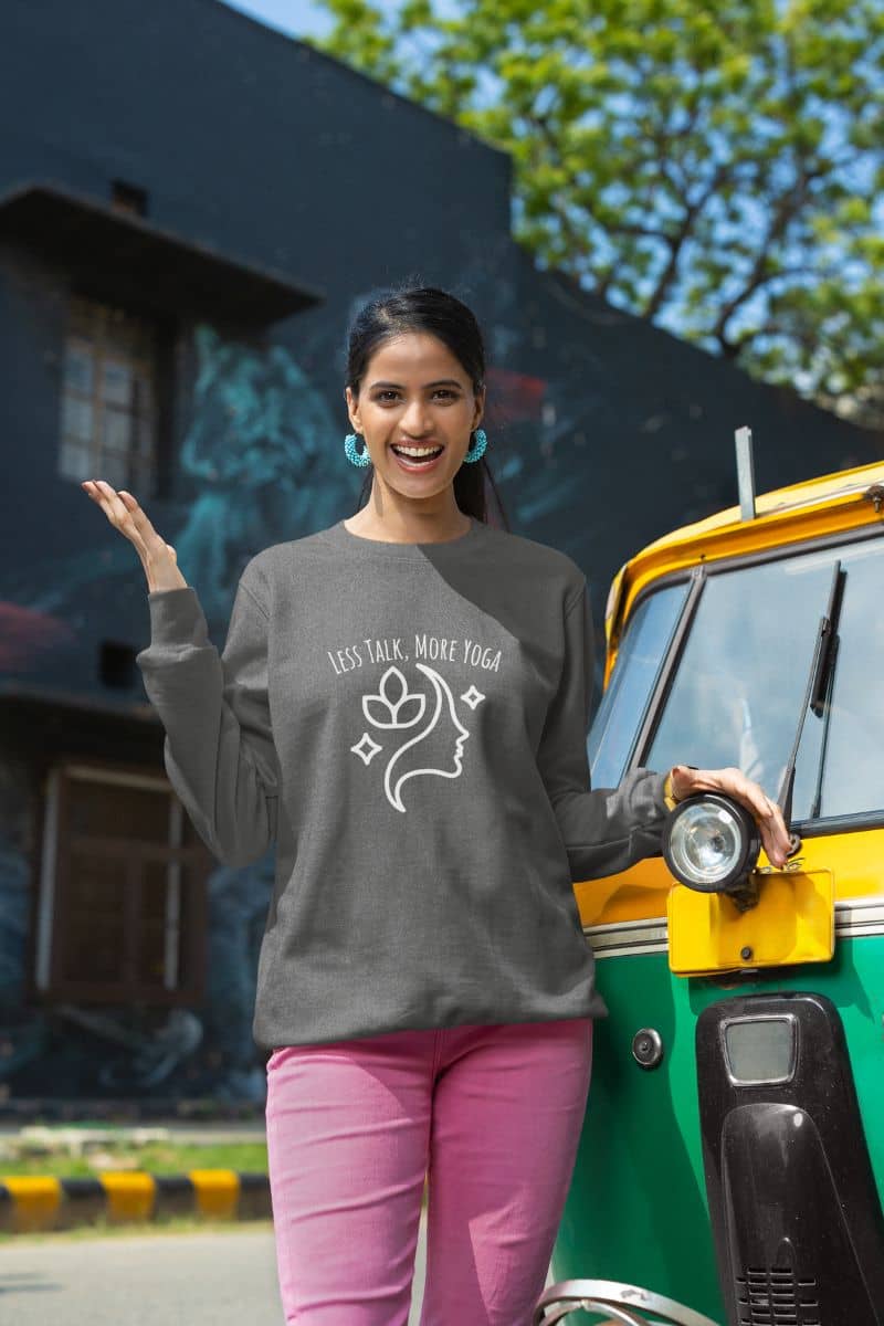 Less talk, more yoga sweatshirt with a girl standing posing in front of the car