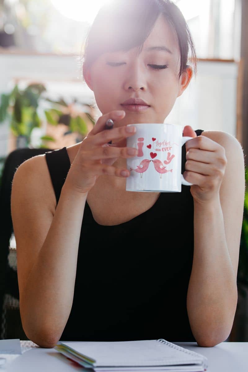 Love birds forever mug with a young girl drinking water while working