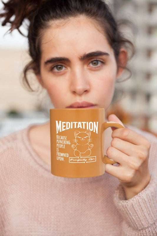 Meditation mug with a beautiful girl holding a cup in front of her