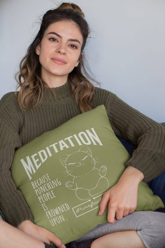 Meditation pillow with a girl sitting on the sofa hugging a square pillow