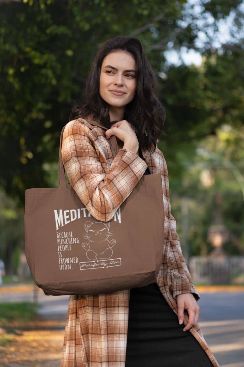 Meditation tote bag with a girl posing while walking on the street