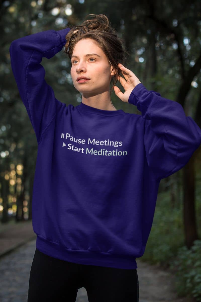 Mental health awareness sweatshirt with a person wearing a blue sweatshirt with text in a forest setting