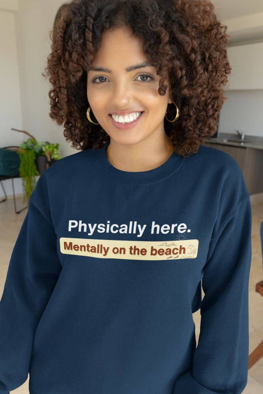 Mentally on the beach sweatshirt with a person wearing a navy sweatshirt with humorous text in a casual indoor setting