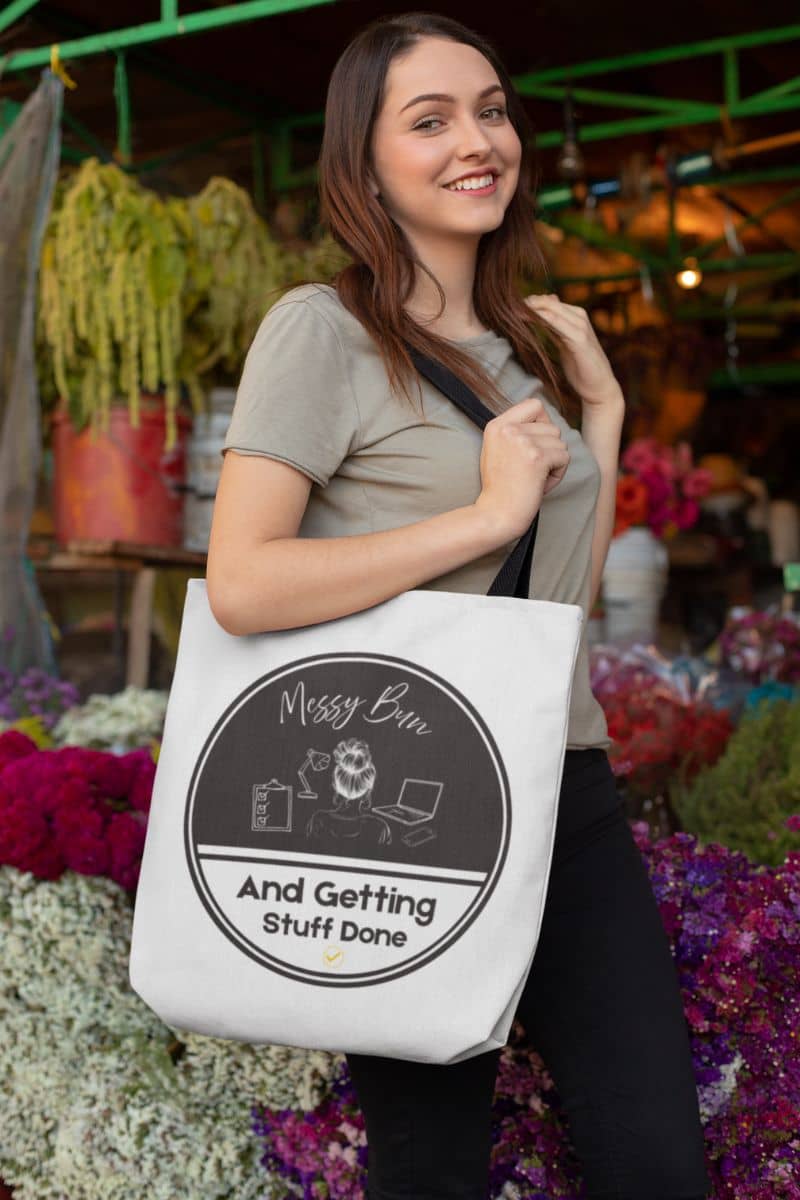 Messy bun tote bag with beautiful girl posing in front of a flower shop with a large tote bag