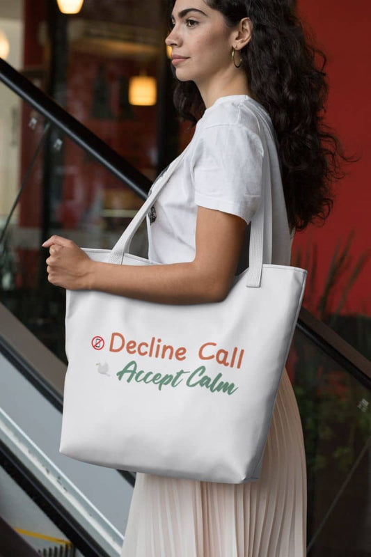 Mindfulness carryall tote with a woman holding a tote bag with text 'Decline Call Accept Calm' in an urban setting.