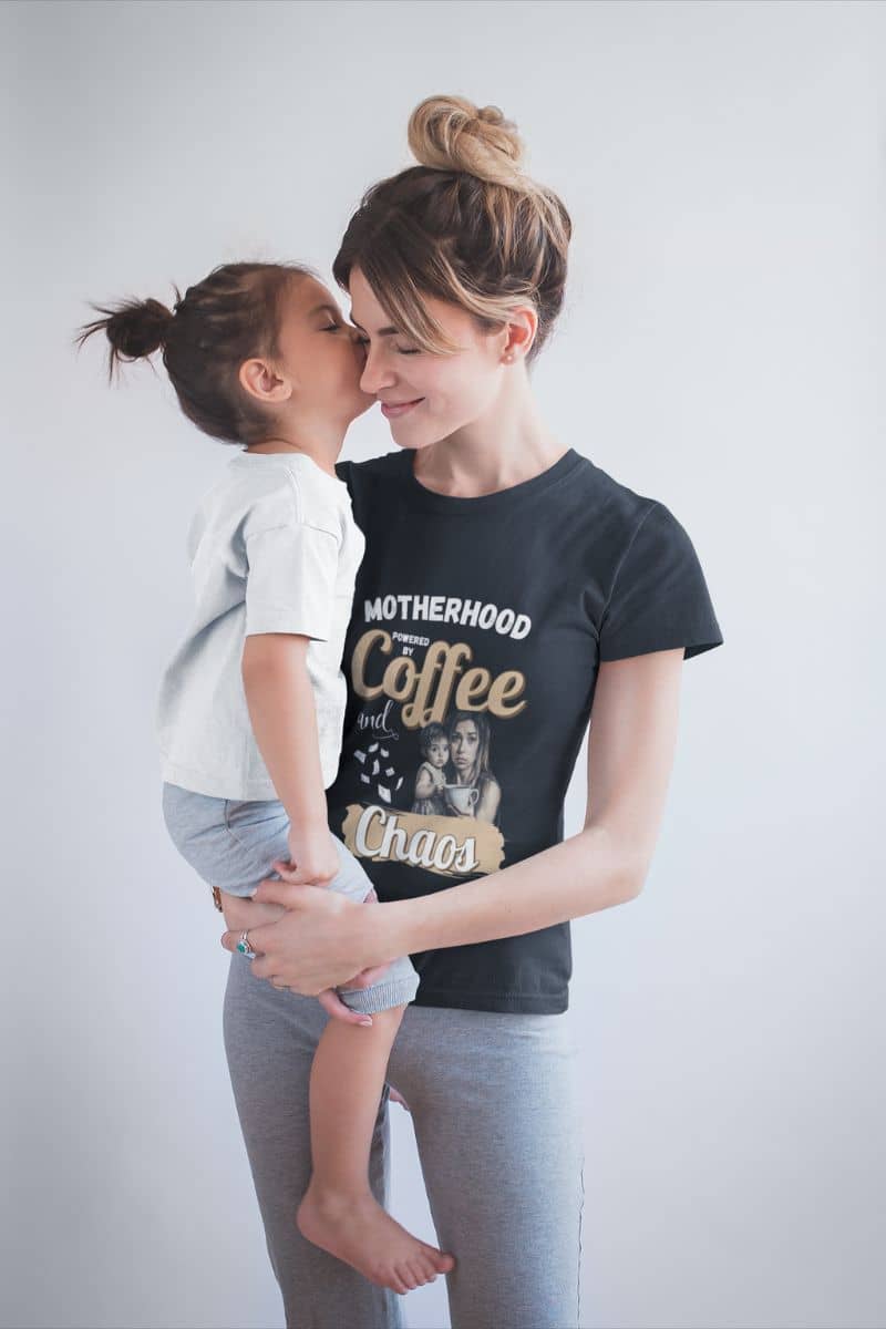 Mom life t-shirt with the baby girl kissing her mother on the cheek while being held in her arms