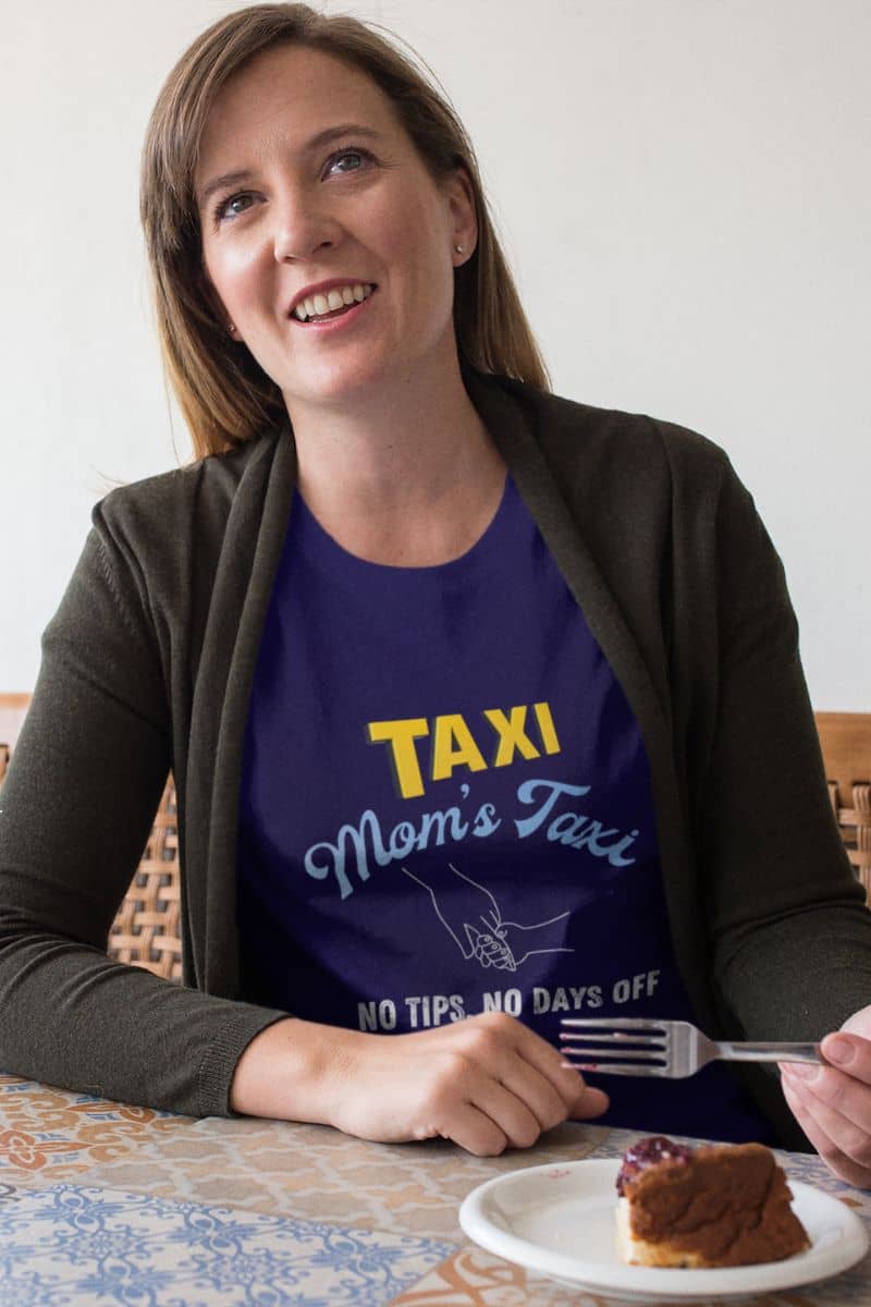 Mom's taxi shirt with a middle-aged woman chatting happily while eating breakfast