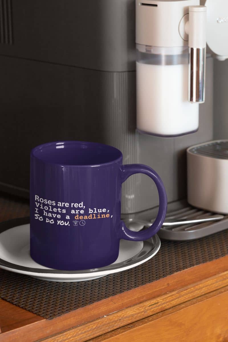 Motivational deadline mug with a cup sitting next to the coffee maker