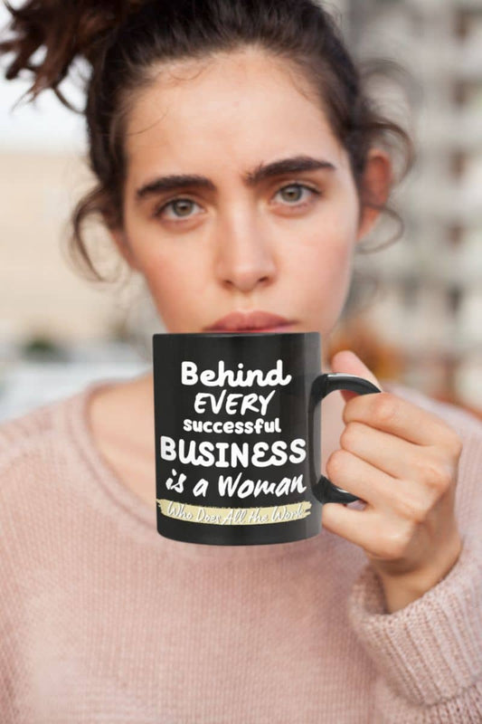 Motivational mugs with a beautiful girl holding a cup of coffee in front of her