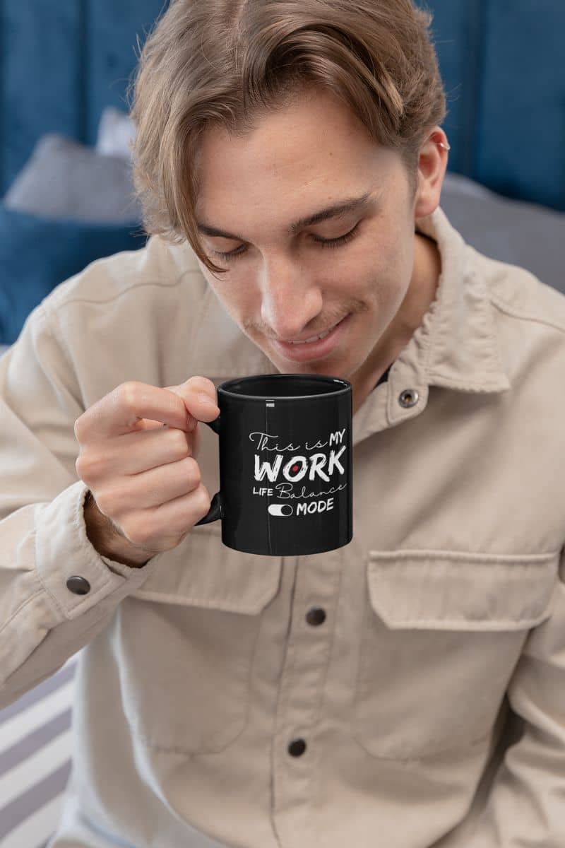 Motivational work life balance mug with a guy holding a cup of coffee and preparing to drink