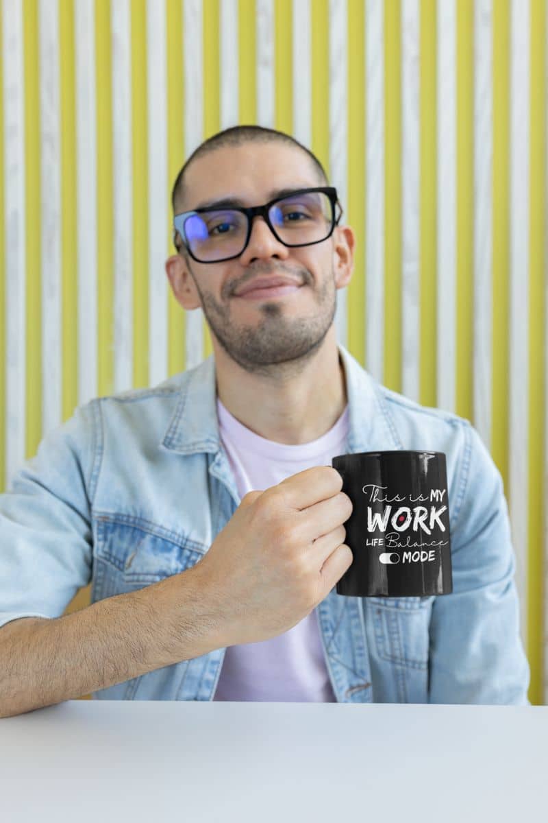 Motivational work life balance mug with a guy holding a cup of coffee in his hand