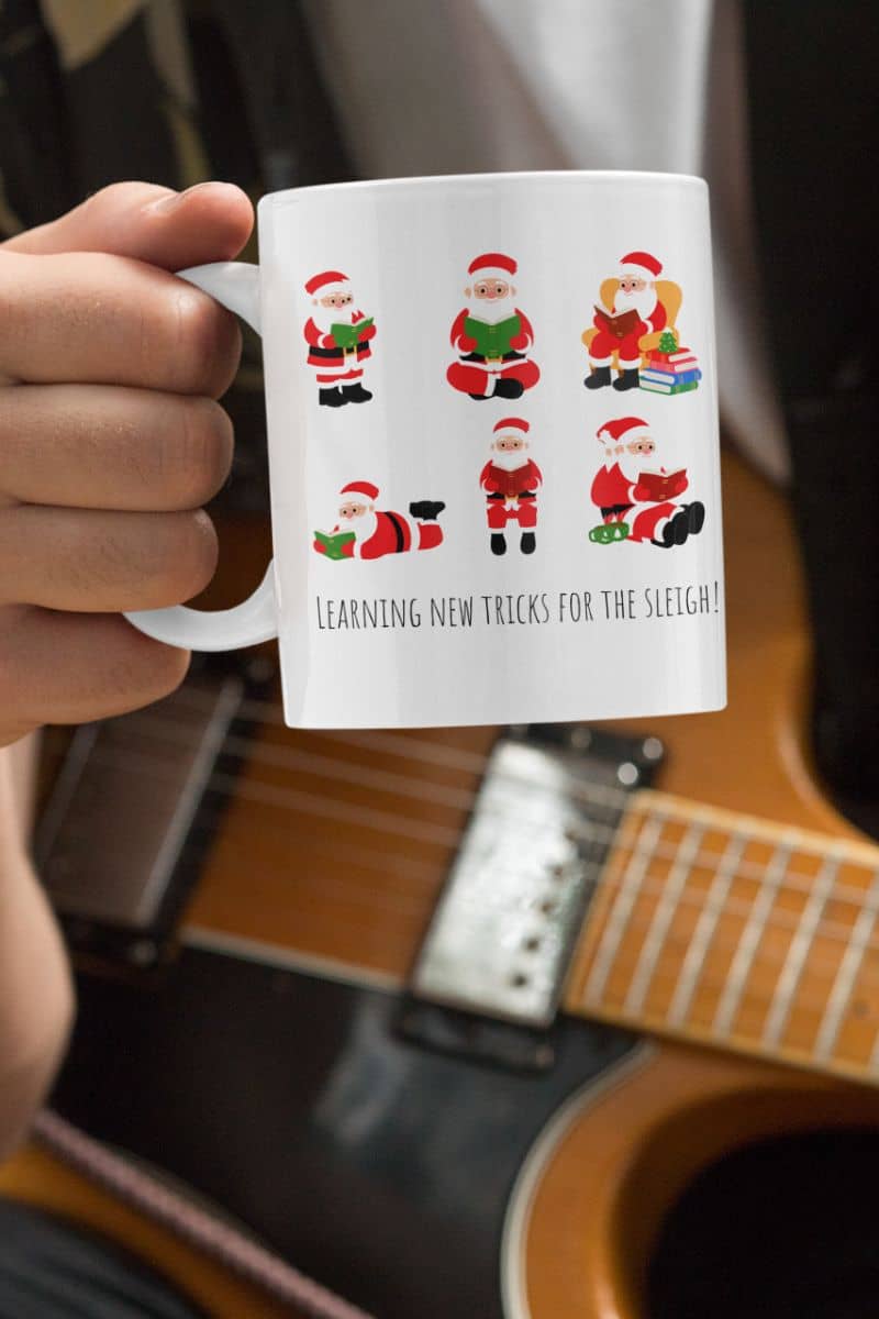 Mug 11oz Learning New Tricks For The Sleigh A with a guy holding a guitar and a glass of water in his hand