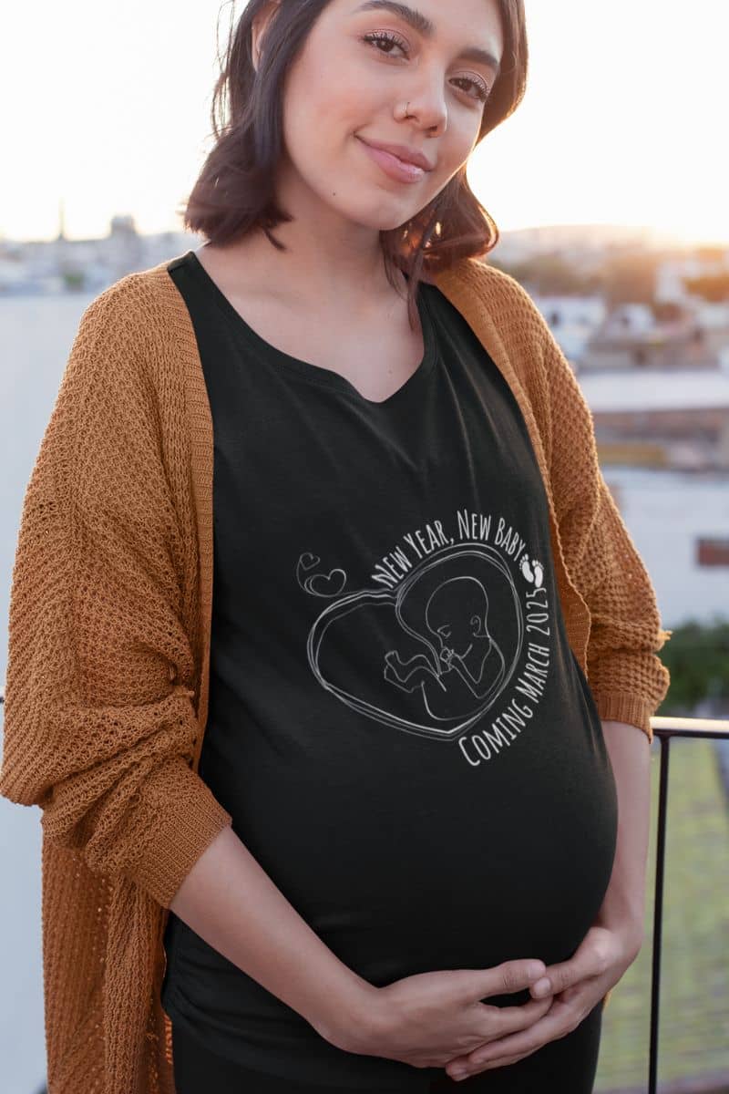New Year, New Baby Coming March 2025 T-Shirt with a pregnant woman holding her belly