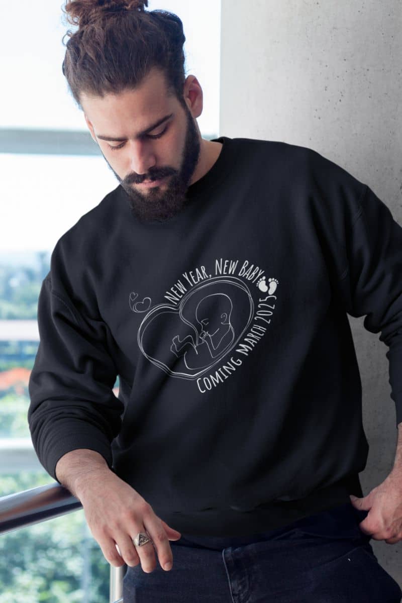 New year, new baby sweatshirt with a guy standing on the balcony and looking down at the ground
