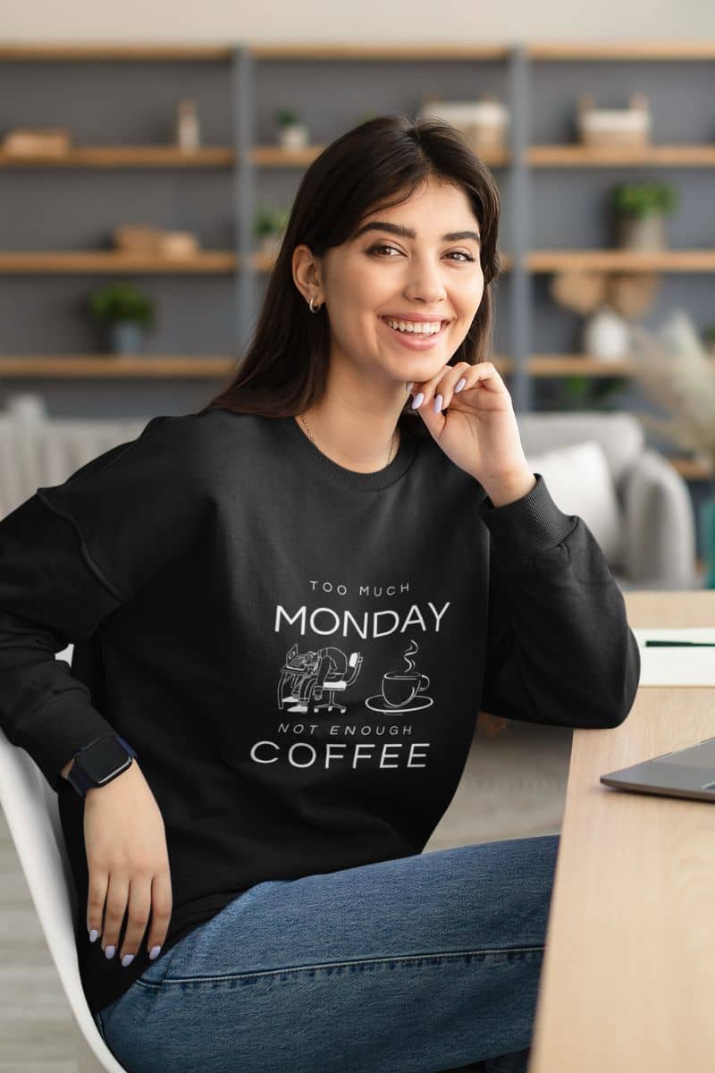 Not enough coffee sweatshirt with the girl smiling brightly while working