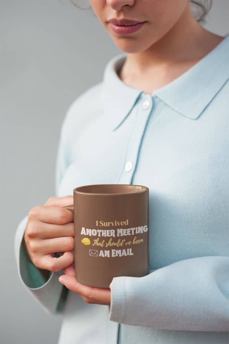 Office coffee mug with the girl looking at the cup in front of her chest