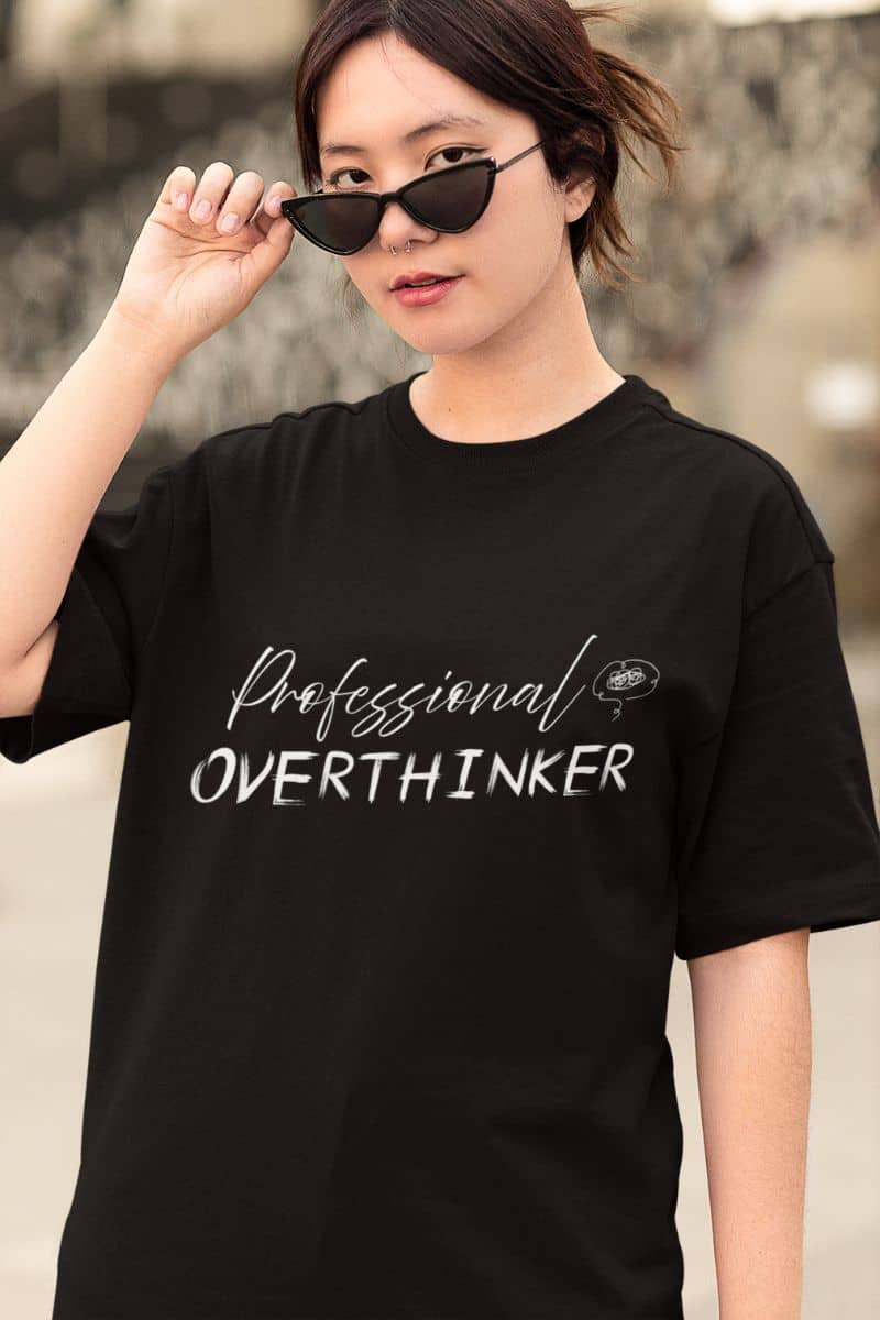 Overthinker t-shirt with a girl posing with fashionable glasses