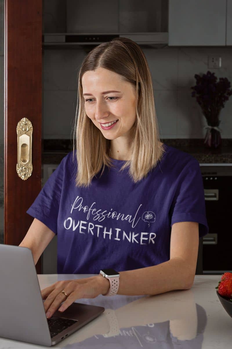 Overthinker t-shirt with a girl sitting working on a laptop