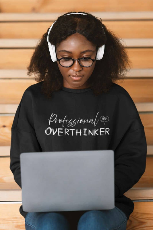 Overthinking sweatshirt with the girl sitting working on the wooden stairs