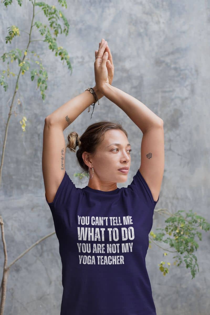 Playful yoga T-shirt with yoga teacher doing yoga pose in yoga class