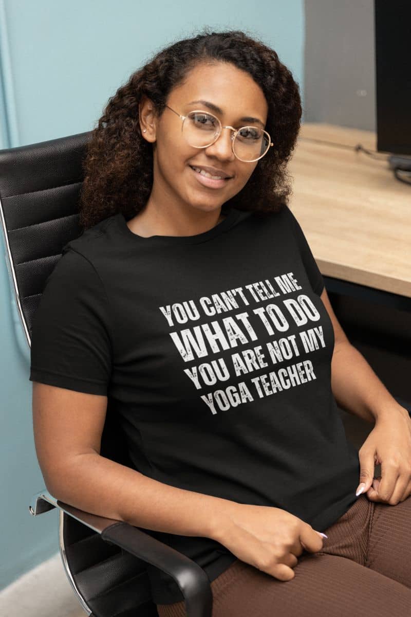 Playful yoga T-shirt with a girl sitting on a chair in a shared office
