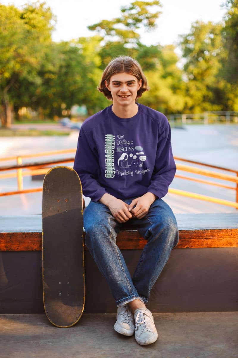 Quiet hustler sweatshirt with a guy sitting next to his skateboard