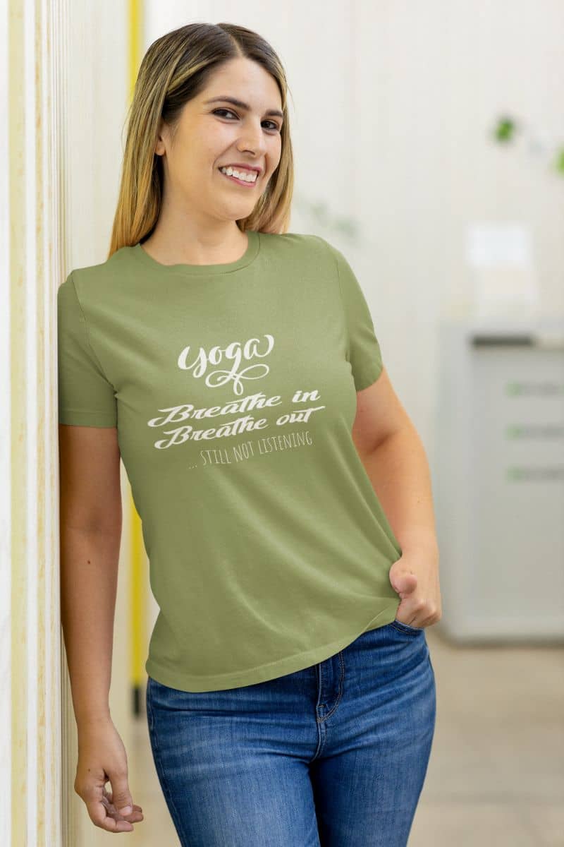Quirky Yoga T-shirt with the girl standing posing against the wall