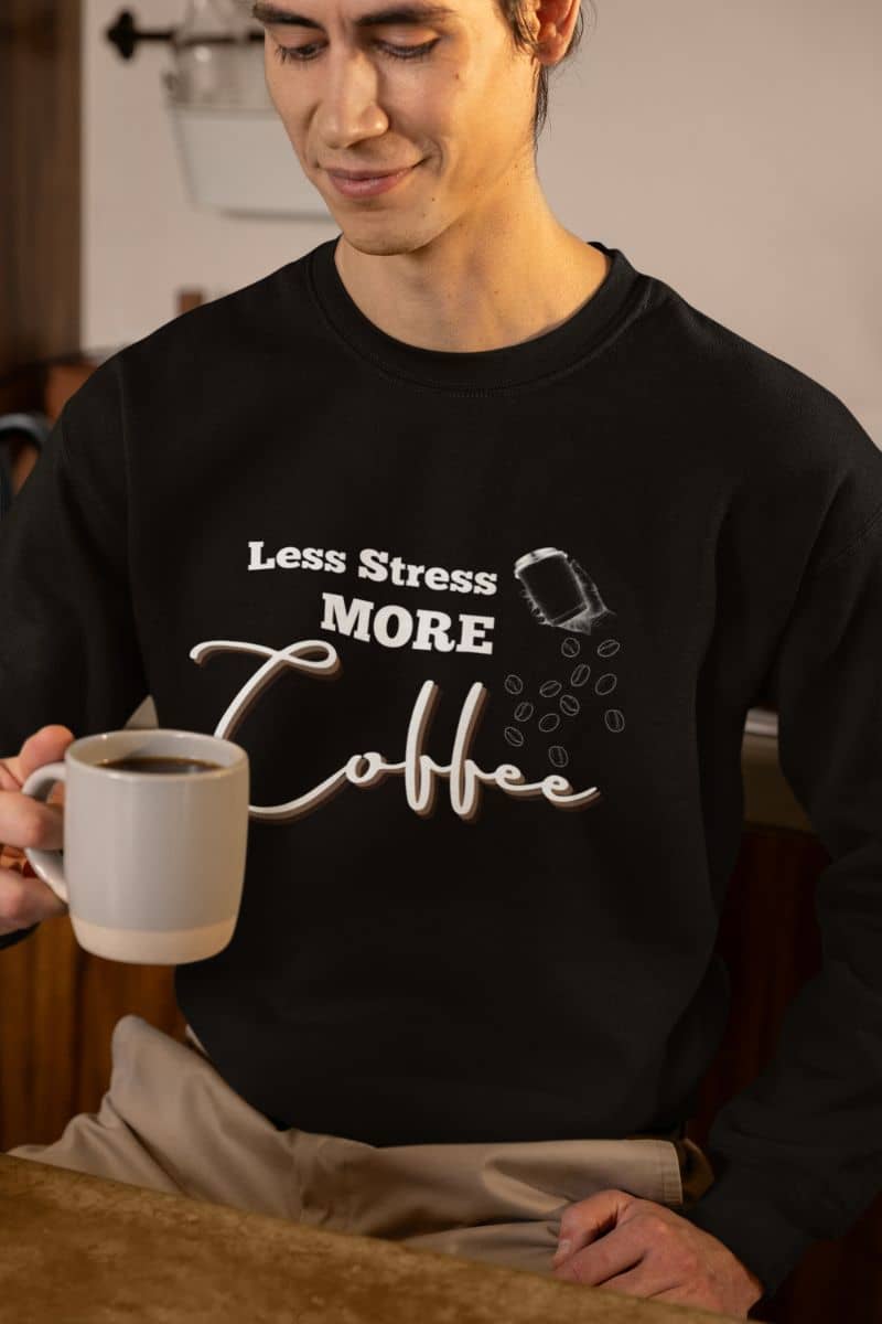 Relaxed coffee sweatshirt with a man looking into his coffee cup