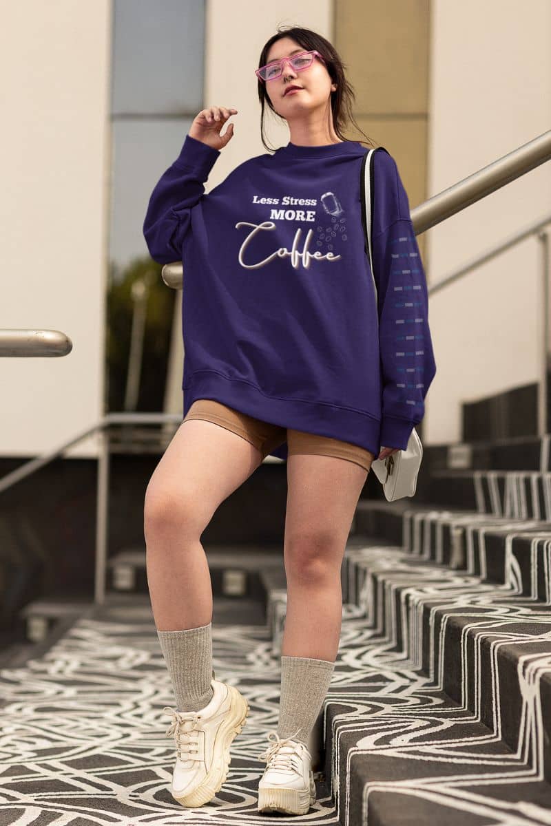 Relaxed coffee sweatshirt with a girl standing posing in a big size sweatshirt with short tight pants