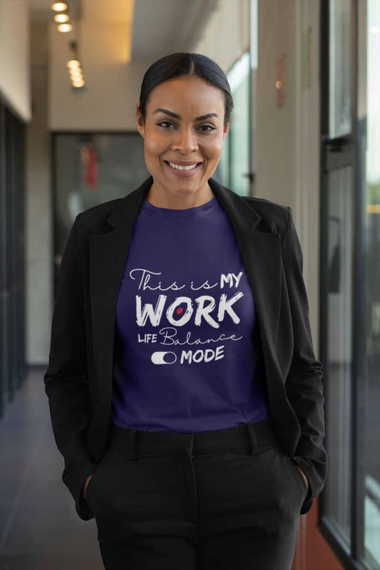 Relaxed work-life balance t-shirt with a woman standing posing in a business suit in the office hallway