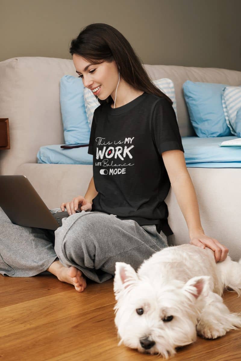 Relaxed work-life balance t-shirt with a girl sitting on the floor working next to her dog