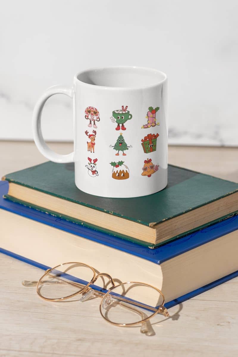 Retro Christmas Vibes Mug with a cup, a pair of glasses and books on the table