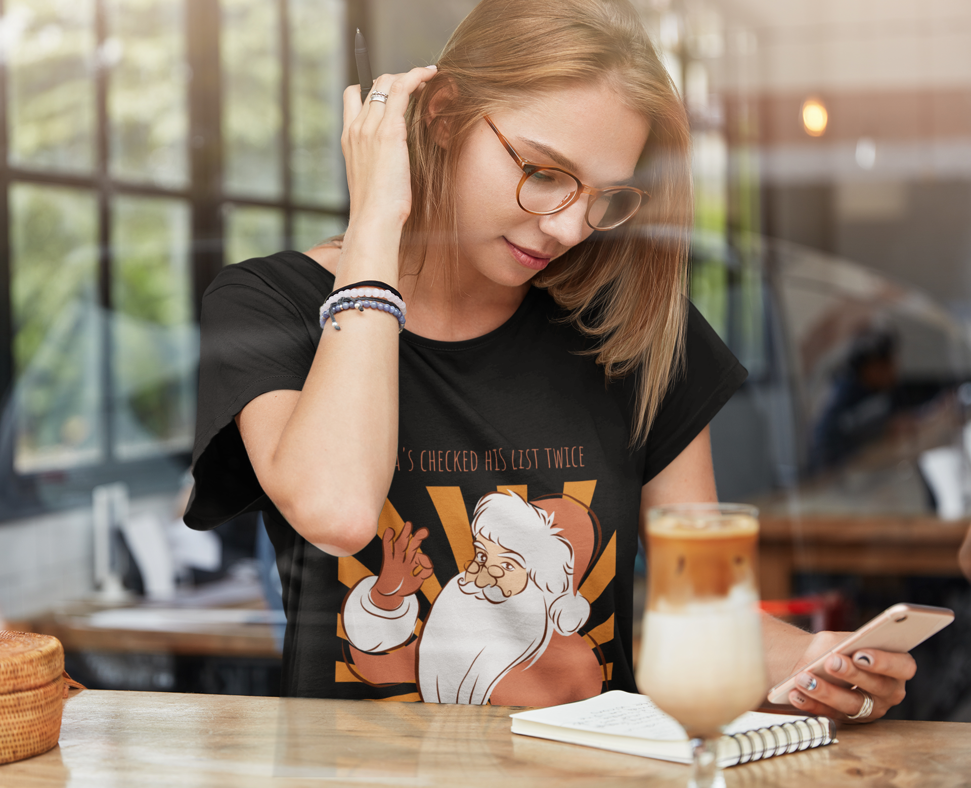 Santa's Checked His List Twice and It's All 'OK'with a girl sitting studying with a cup of iced milk coffee
