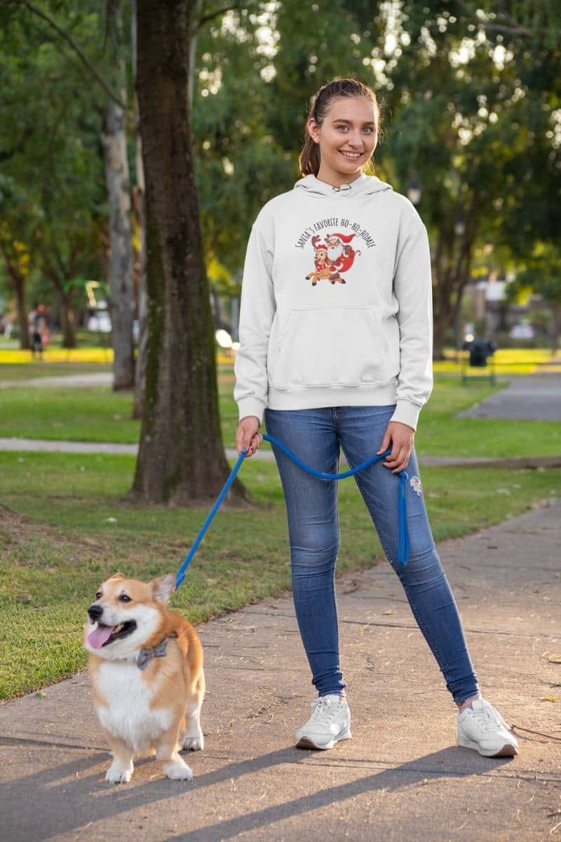 Cozy Christmas Hoodie with a girl walking her dog