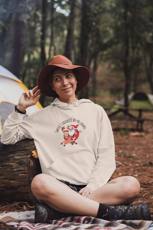 Cozy Christmas Hoodie with a girl posing near her tent