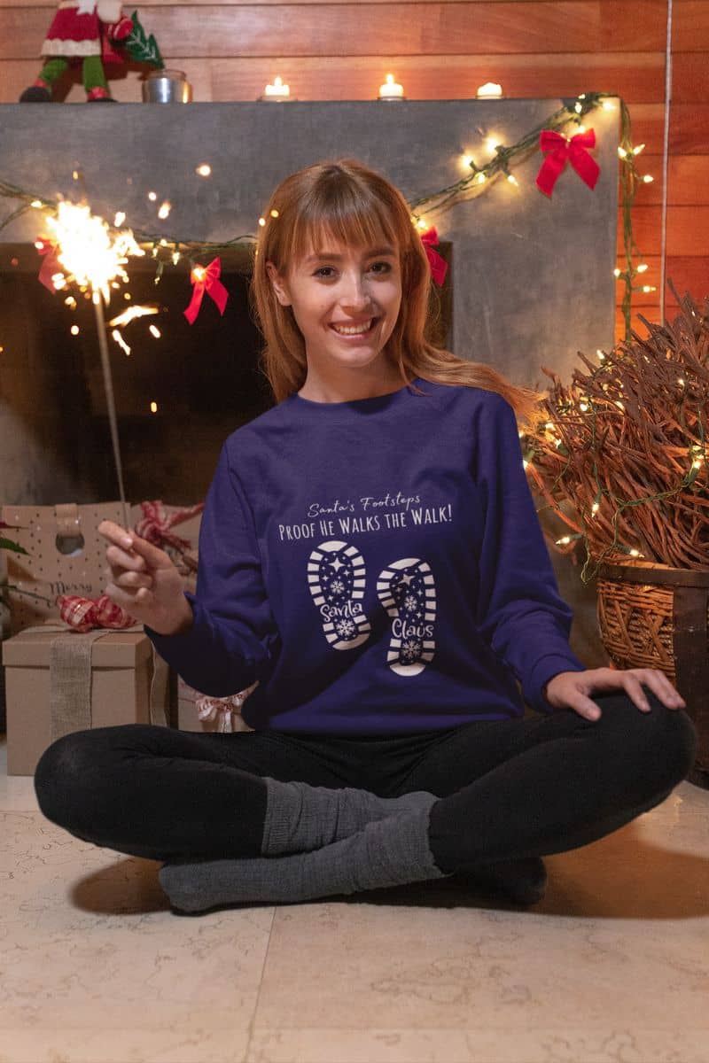 Santa's Footsteps Sweatshirt with girl holding fireworks on christmas day