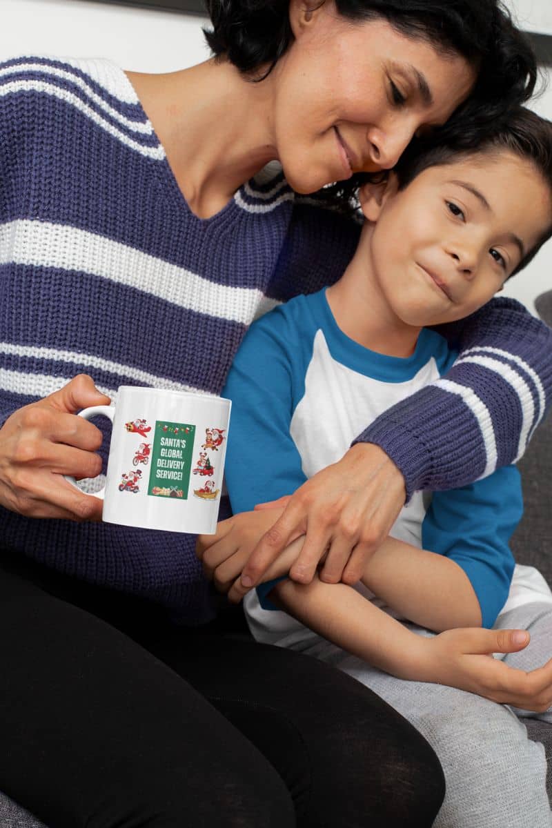 Santas Global Delivery Service Mug with a woman holding her son