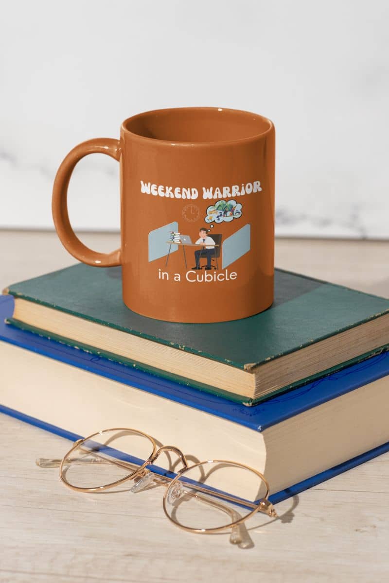 Sarcastic mug with a coffee cup resting on two large books
