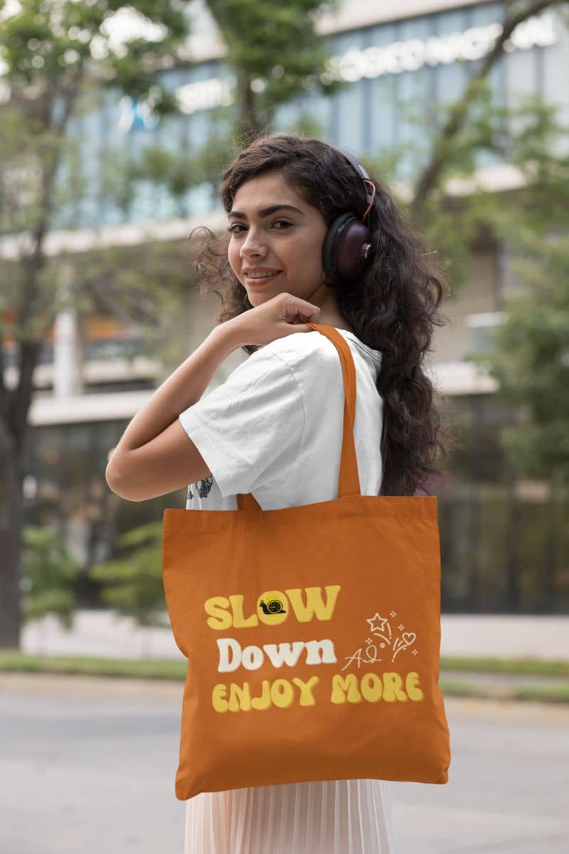 Slow living tote bag with a girl posing with headphones on her head