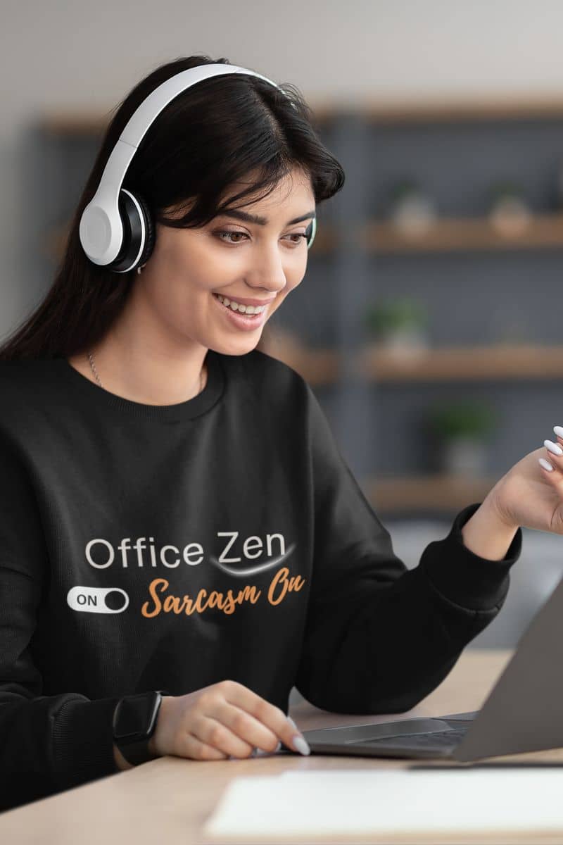 Soft fleece sweatshirt with a woman wearing headphones and a black sweatshirt with 'Office Zen' text, sitting at a desk.