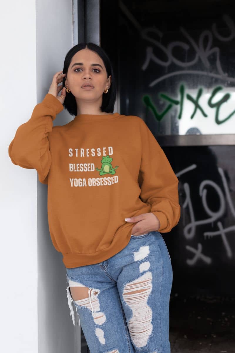 Stressed? blessed yoga obsessed sweatshirt with a short-haired girl leaning against the wall of a store