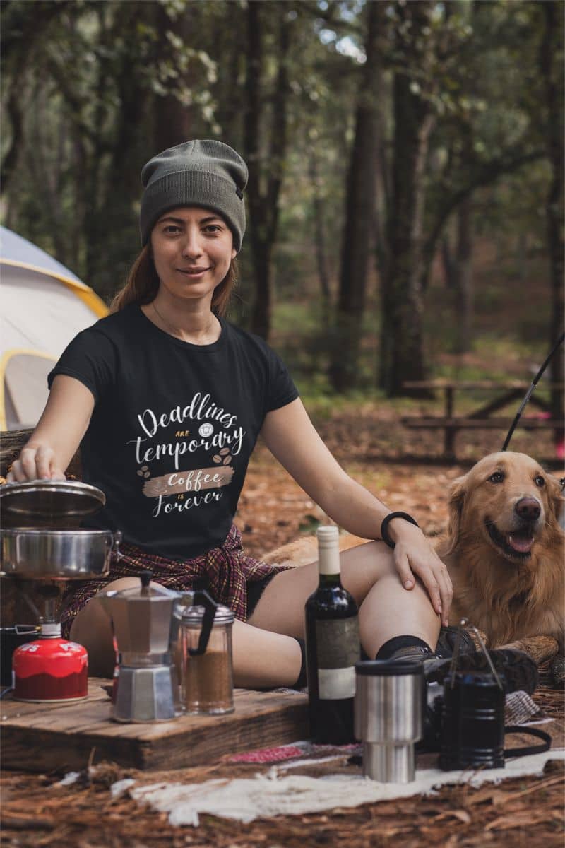 Trendy caffeine lover t-shirt with a woman cooking while camping