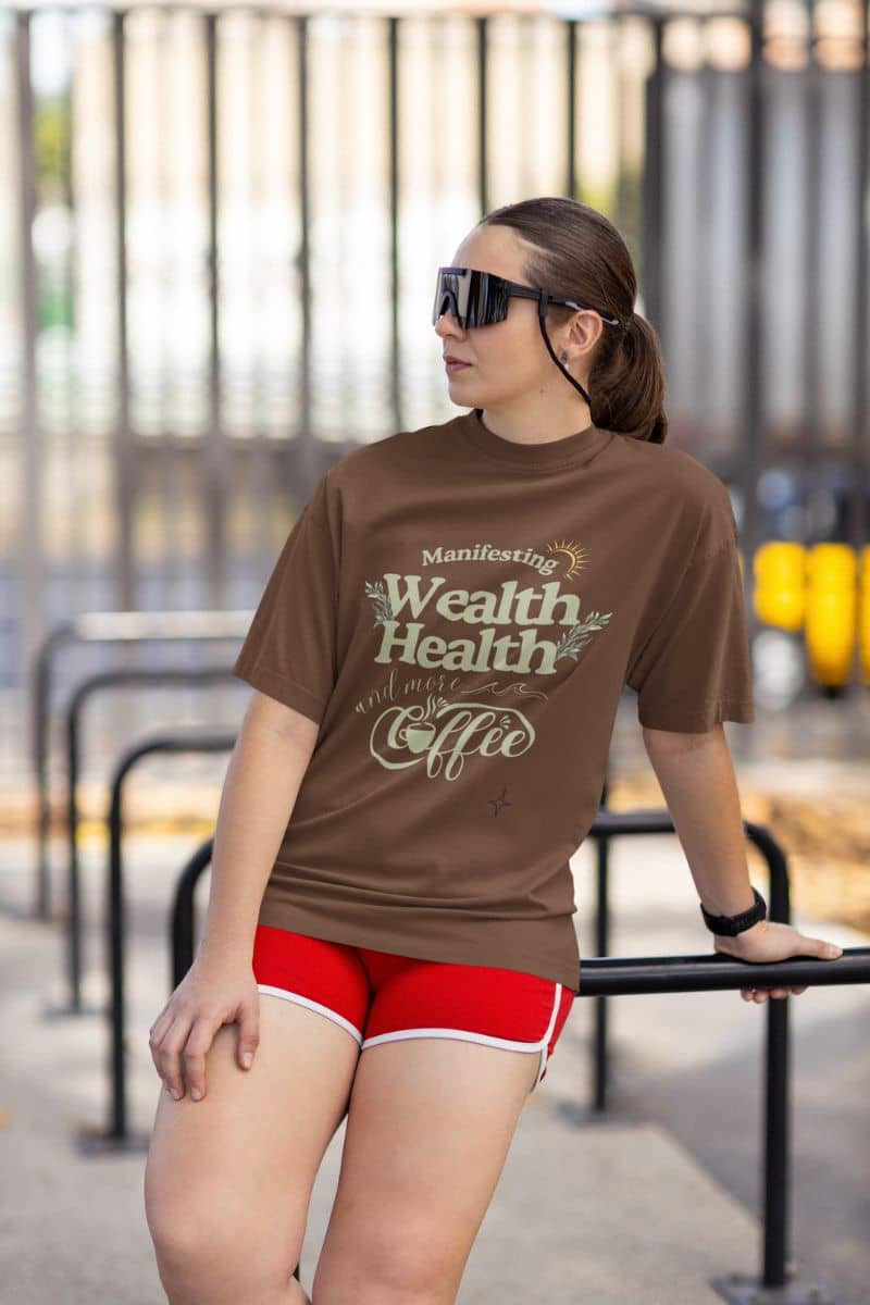 Trendy manifestation t-shirt with young girl leaning against railing while jogging