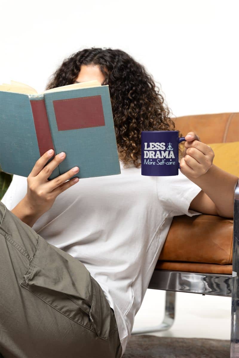 Unique ceramic mug with a girl holding a cup in her hand while reading a book